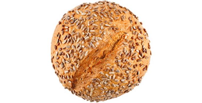 El pan de masa madre se puede decorar con semillas. Pan de masa madre con semillas.