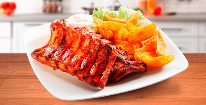 Costilla de res en salsa criolla con papa chalequeada